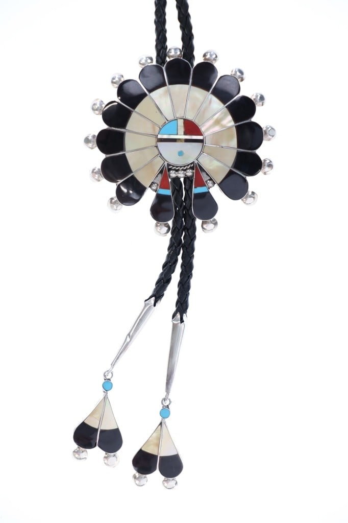 Zuni Pauline Lonjose Sterling Inlay Sunface Bolo: Presented in this lot is this Stunning Zuni Pauline Lonjose Sterling Silver Multistone Inlay Sunface Bolo Tie. This impressive bolo tie features a wonderfully and professionally crafted sterling silve