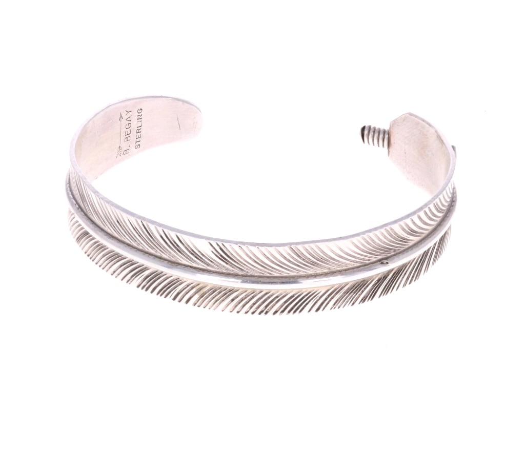 Navajo B. Begay Sterling Feather Cuff Bracelet: Featured in this lot is this Navajo, sterling feather cuff bracelet from Navajo silversmith B. Begay. This bracelet features a wonderfully and professionally crafted sterling feather design with great