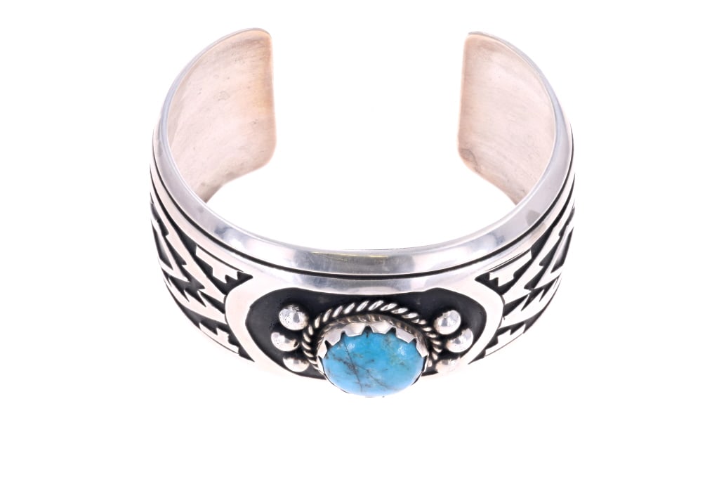 Navajo T&R Singer Turquoise Sterling Cuff Bracelet: Featured in this lot is this Navajo Sterling Silver Cuff Bracelet made by Navajo artists Thomas & Rose Singer. Singer is thought to be one of the most important and greatest contemporary silversmith a