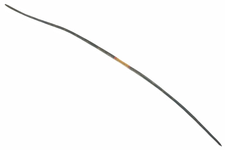 Northern Plains Painted Wooden Bow 1900's: The features a wood bow fully painted from the Northern Plains of the early-to-mid-1900's. The bow shows a dark color paint with banded yellow and red / orange design at the gripping area. The bow sho