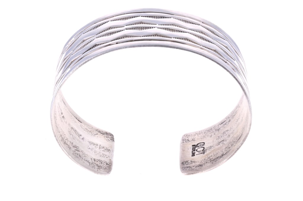 Navajo Chaz Tsosie Sterling Cuff Bracelet: Featured in this lot is this Navajo sterling cuff bracelet made by renowned Navajo silversmith Chaz Tsosie. The bracelet features a wonderfully and professionally crafted sterling silver construction.