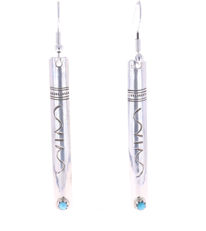 Navajo Sterling & Turquoise Earrings: Featured in this lot is this pair of Navajo, sterling & Sleeping Beauty turquoise earrings. These earrings show a sterling construction and are set with a small cabochon of Sleeping Beauty turquoise s