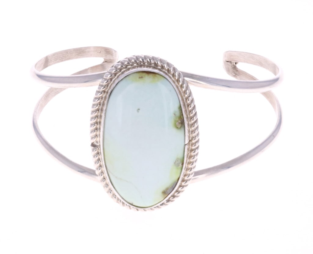 Navajo C. Tsosie Sterling & Palomino Cuff Bracelet: Featured in this lot is this Navajo, sterling & Palomino cuff bracelet done by Navajo silversmith Chaz Tsosie. This bracelet features a sterling construction and shows a double strand style cuff brace