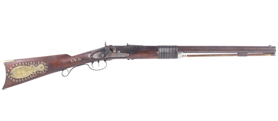 Mid-19th C. Henry Leman Rifle w/ Stage Stamp: The lot features a mid-19th century cap and ball black powder octagon rifle attributed to Leman (Henry H. Leman Lancaster, Pennsylvania) with brass tacking and stamped. The rifle exhibits hand cut rif