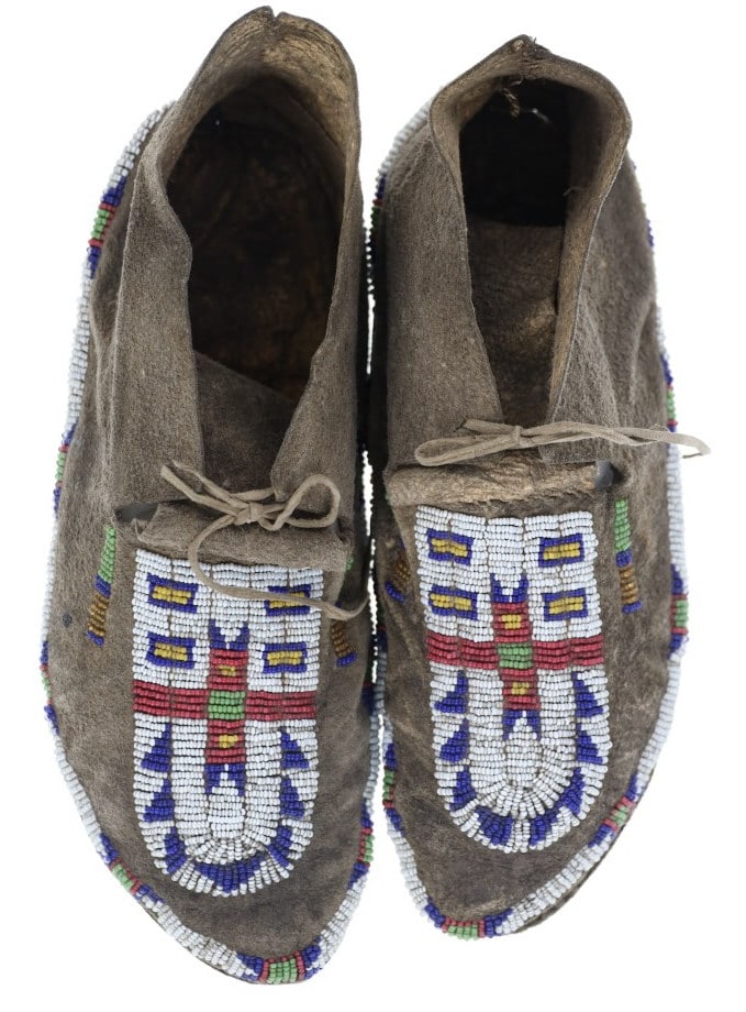 Ca. 1870 Crow Beaded Buffalo Moccasins ex-Cowan's: This is a fabulous set of circa 1870 Crow Beaded Buffalo Hide Moccasins from an ex-Cowan's auction. The set were identified as 1870 Crow Beaded Buffalo Hide Moccasins by the experts at Cowan?s in 2012