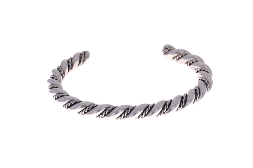 Navajo Solid Sterling Rope Twist Cuff Bracelet: Featured in this lot is this sturdy, Navajo sterling rope twist cuff bracelet. The cuff or bracelet has a nice heavy construction and is in very good condition. The piece is not signed, as there are n