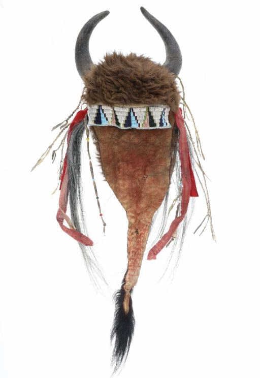 Kiowa Buffalo Horn Beaded Bonnet Headdress: The lot features a beaded buffalo bison horn headdress bonnet from the Kiowa from a large Santa Rosa, California private collection. The bonnet is comprised of Indian tanned buffalo bison hide with fu