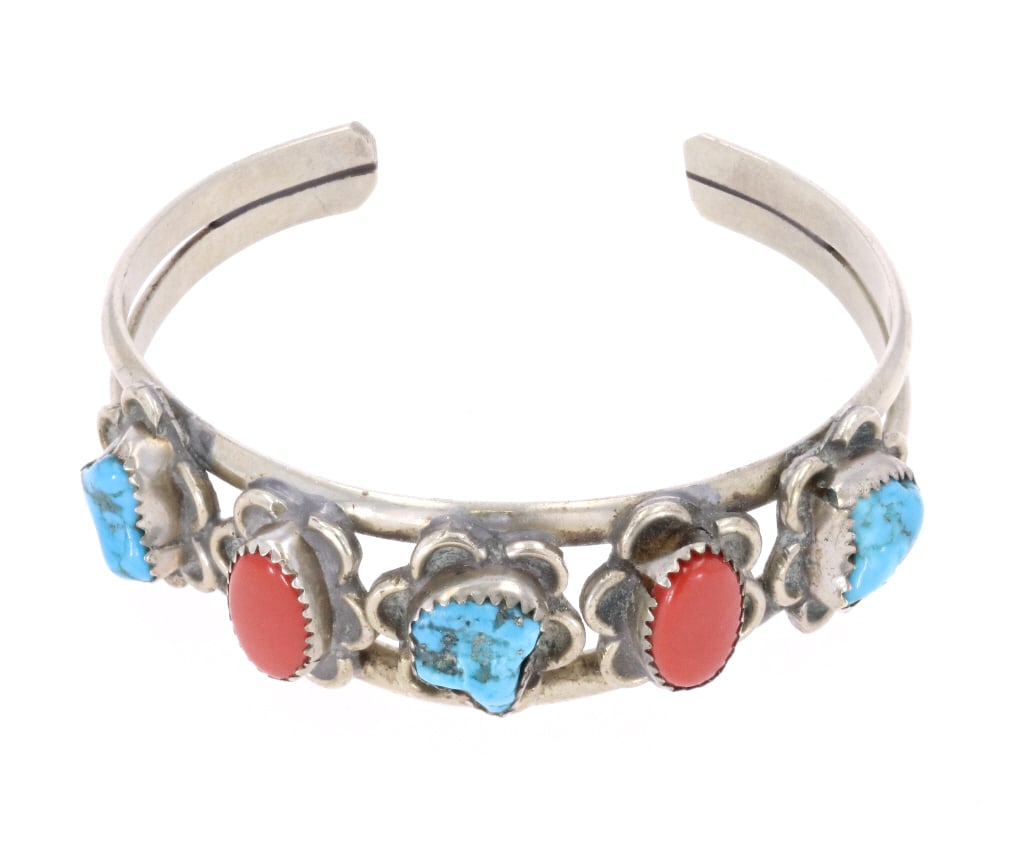 Navajo Turquoise & Red Branch Coral Bracelet: Featured in this lot is this Navajo turquoise and red branch coral bracelet. The bracelet features a wonderfully and professionally crafted sterling silver, turquoise, and red branch coral constructio