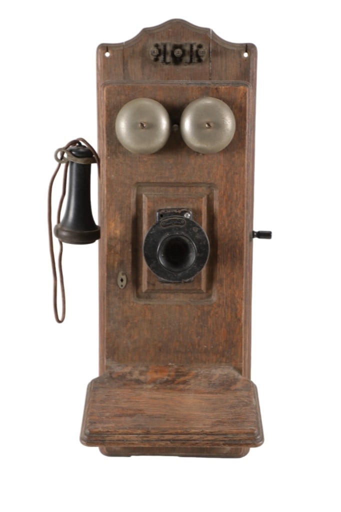 Ca. 1913 Western Electric Oak Wall Telephone: Featured in this lot is this Western Electric oak wall telephone circa 1913. The telephone features a wonderfully and professionally crafted oak furniture construction with metal, both copper and stee