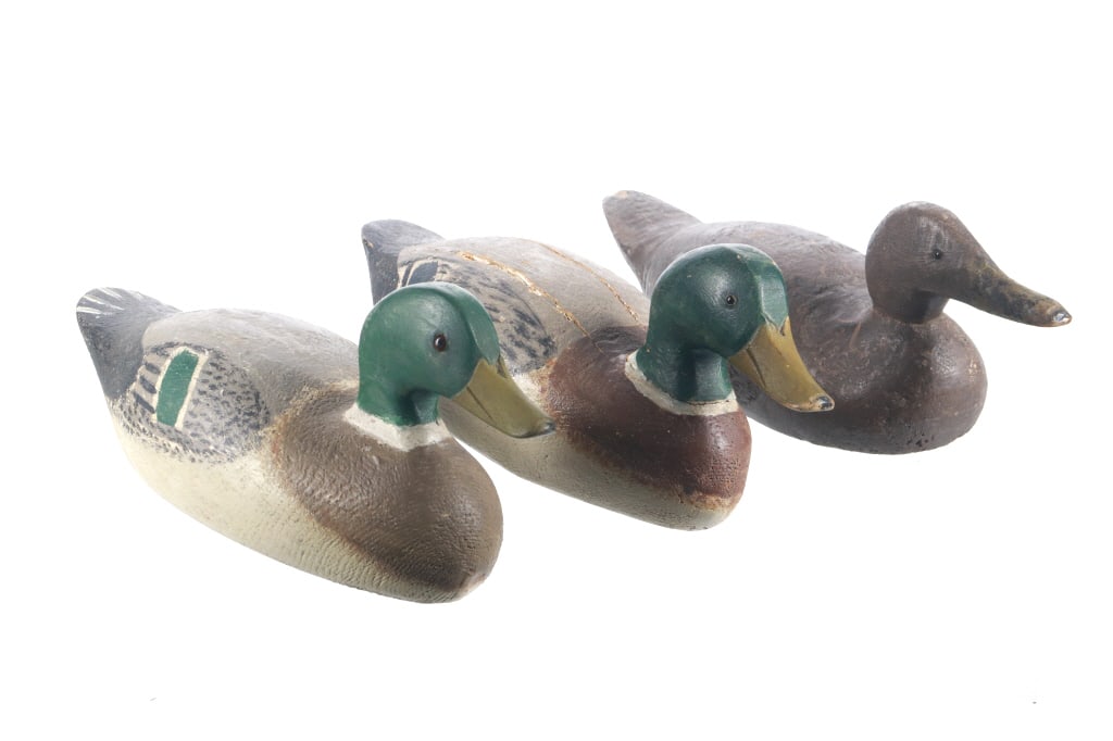 Ca. 1950s Mallard Drakes & Hen Decoys by Gus Nelow: Featured in this lot is this Pair of Mallard Drakes & Hen Decoys by Gus Nelow. The first of the three Mallard decoys is the largest showing realistic coloring for a drake Mallard, however it also show