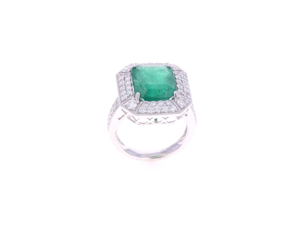 5.56 CTW Emerald, 1.18 CTW Diamond & Platinum Ring: Featured in this lot is this beautiful, platinum, natural 5.56 CTW emerald beryl & 1.18 CTW diamond ring with GGA and GIA paperwork. The ring features a professionally crafted platinum construction, w
