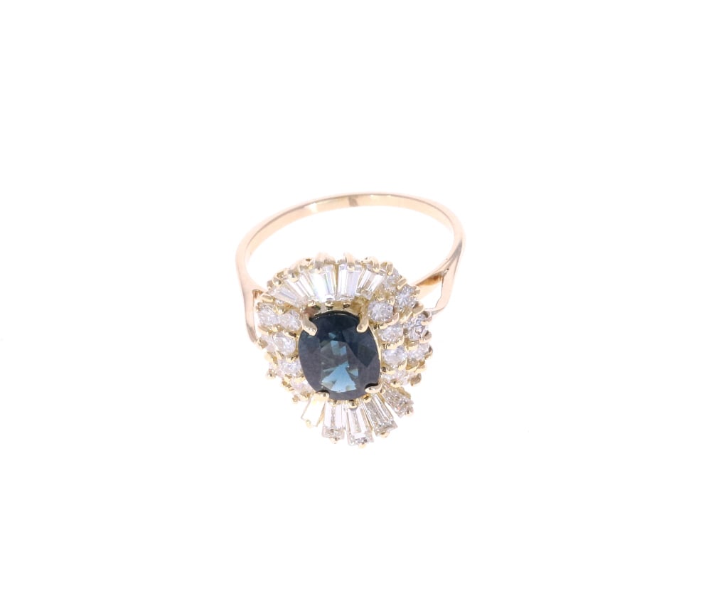 GGA 14K Gold, 1.87 CTW Sapphire & Diamond Ring: Featured in this lot is this beautiful 14K Yellow Gold Natural Blue Sapphire Corundum Diamond Ring. The ring features a wonderfully and professionally crafted yellow gold construction with the oval br