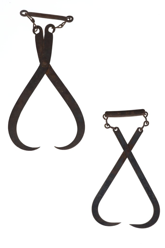 Commercial Cast Iron Ice Tongs c. 19th Century: Featured in this lot is this Commercial cast iron ice tongs circa 19th century. The ice tongs feature a wonderfully and professionally crafted cast iron construction that uses leverage to grip to a bl