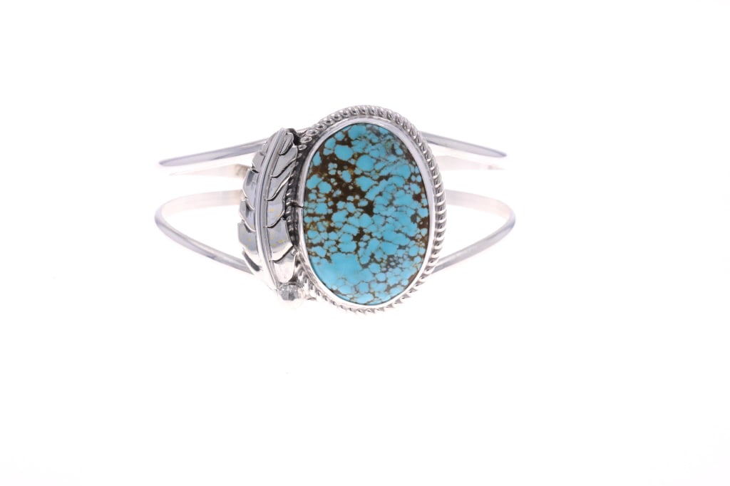 Navajo Chaz Tsosie Sterling & Turquoise Bracelet: Featured in this lot is this Navajo, sterling & Number 8 turquoise bracelet made by Navajo silversmith, Chaz Tsosie. The bracelet features a wonderfully and professionally crafted sterling silver and