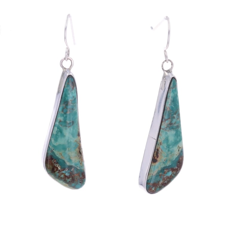 Navajo John Begay Jr. Sterling Turquoise Earrings: Featured in this lot are these Navajo Din? John Begay Jr. Sterling Silver Royston Turquoise Dangle Earrings. The earrings feature a wonderfully and professionally crafted sterling silver featuring two