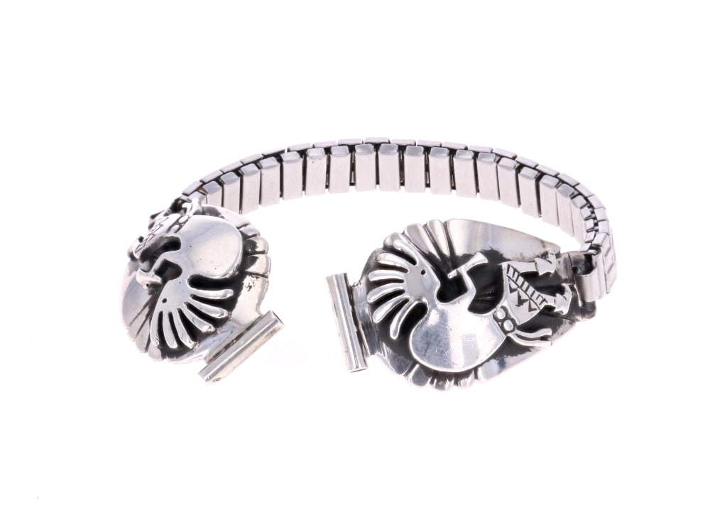 Navajo Sterling & Stainless Steel Watch Cuff: Featured in this lot is this beautiful, Navajo sterling & stainless steel Kokopelli Kachina watch cuff. This watch cuff features no watch face and no makers mark or hallmark. The bracelet is stainless