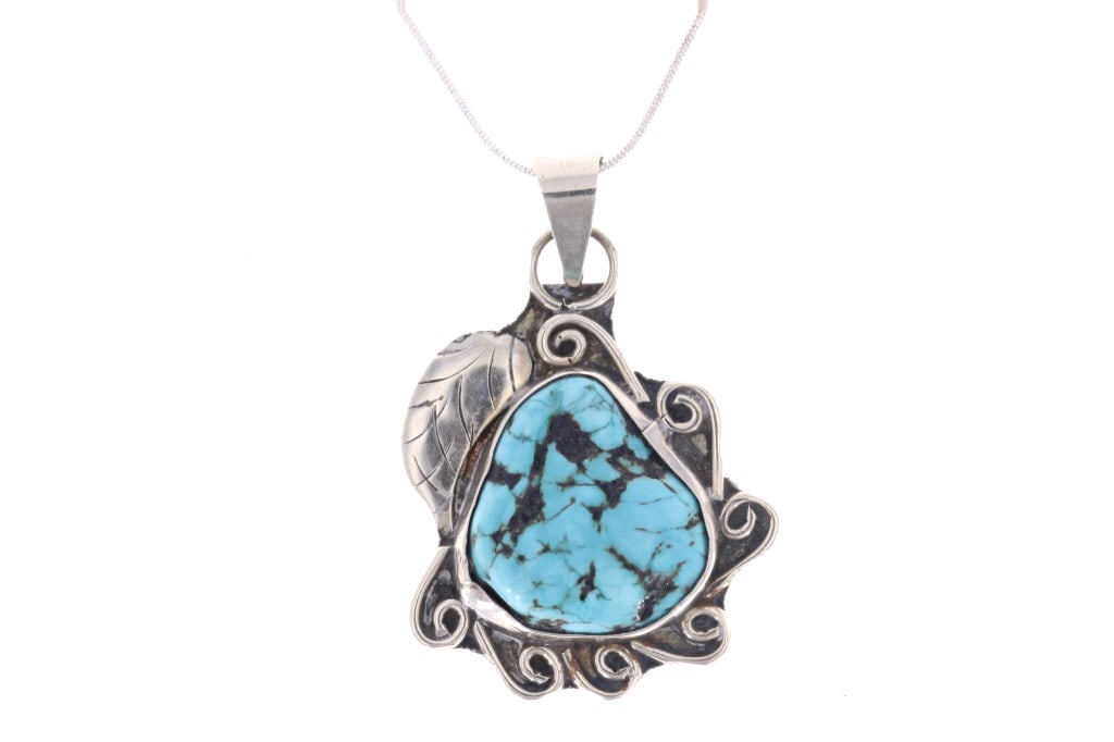 Navajo Sterling Silver Turquoise Necklace c. 1960s: Featured in this lot is this Navajo sterling silver turquoise necklace circa 1960's. The necklace features a wonderfully and professionally crafted sterling sing and turquoise construction that shows