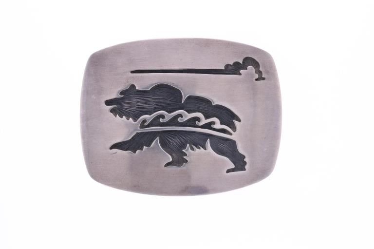Navajo T Thomas Sterling Silver Bear Buckle: Presented in this lot is this Navajo Sterling Silver Bear Belt Buckle, signed T. Thomas. The buckle shows a wonderfully and professionally crafted sterling silver construction that shows a scene of a