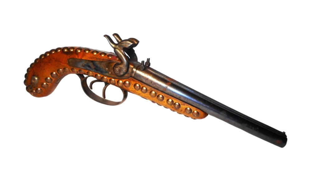 19th-C American Indian Tacked Double Barrel Pistol: The lot features a late-19th-century double barrel side by side percussion pistol with beautiful American Indian brass tacking. The pistol shows a double barrel percussion cap black powder example