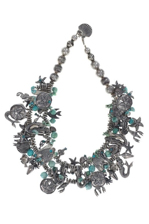 Vintage "Under The Sea" Silver Charm Necklace: Featured in this lot is this vintage "Under the Sea" silver charm necklace circa 1960 to 1970's. The necklace features a wonderfully and professionally crafted silver and turquoise construction that s
