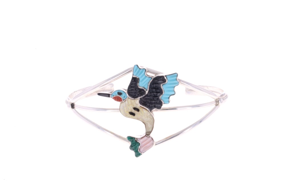 Zuni Tamara Pinto Hummingbird Inlay Cuff Bracelet: Presented in this lot is a Zuni Tamara Pinto Sterling Silver Hummingbird Multi-Stone Inlay Cuff Bracelet, featuring turquoise, coral, malachite, mother of pearl and pink mussel shell. This inlay cuff