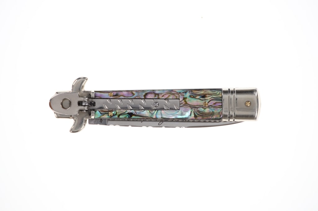 AKC Italian Leverletto Switchblade Bill DeShivs: Featured in this lot is this beautifully crafted Italian AKC Leverletto switchblade knife with abalone handle by Bill DeShivs. The knife displays a single edged drop point style blade, abalone grips,