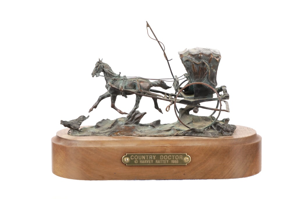Montana, Harvey Rattey "Country Doctor" Bronze: Featured in this lot is this bronze sculpture titled "Country Doctor" by Montana artist Harvey Rattey circa 1988. The sculpture features a wonderfully and professionally crafted bronze on wooden base
