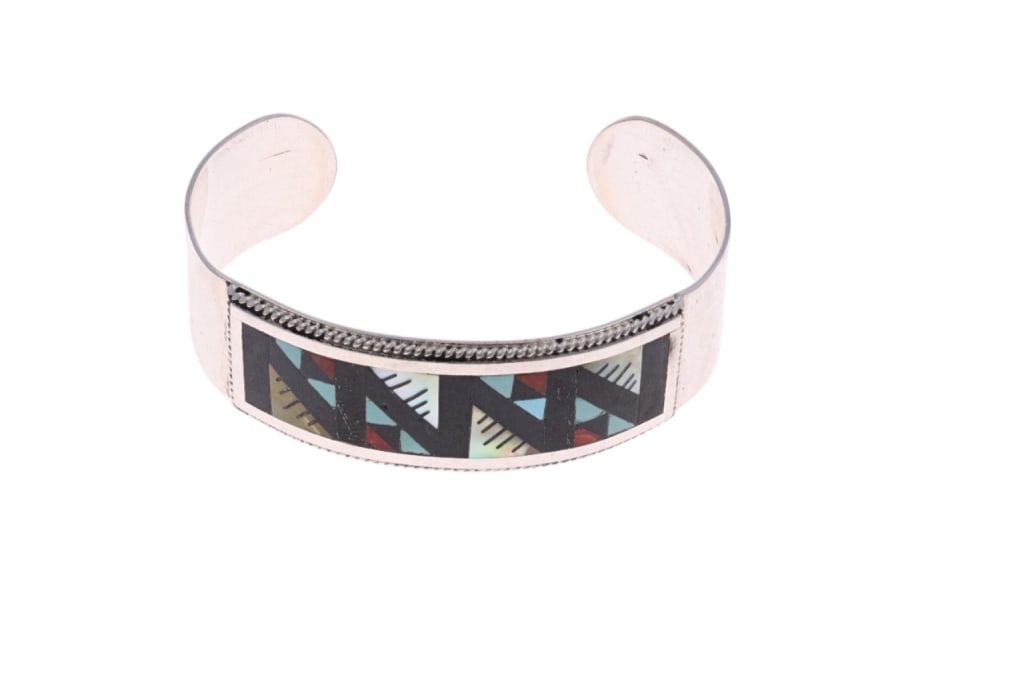 Vintage Pawn Zuni Leander & Lisa Othole Buckle: Presented in this lot is an Original Vintage Pawn Zuni Leander & Lisa Othole Multi-Stone Inlay Cuff Bracelet, 20th-century. This stunning cuff bracelet features a wonderfully and professionally