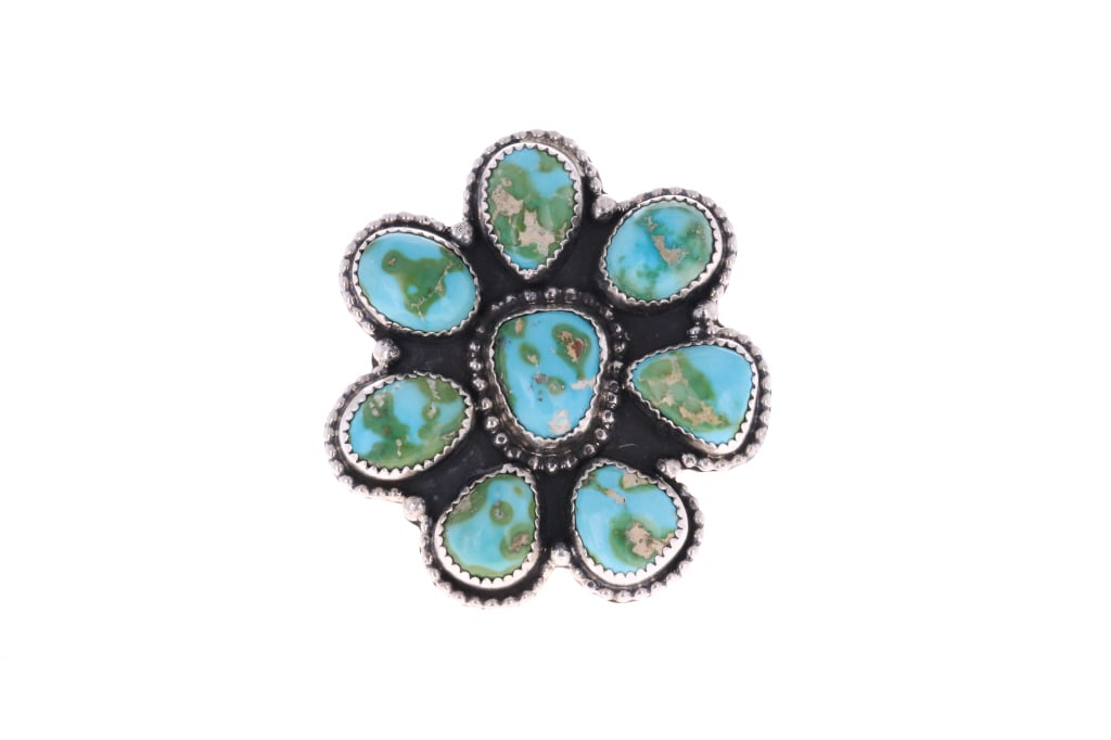 Navajo R. Sam Sterling Silver C.C. Turquoise Ring: Featured in this lot is a sterling silver cripple creek turquoise ring from Navajo artist, R. Sam. The ring features a wonderfully and professionally crafted sterling silver and cripple creek turquois