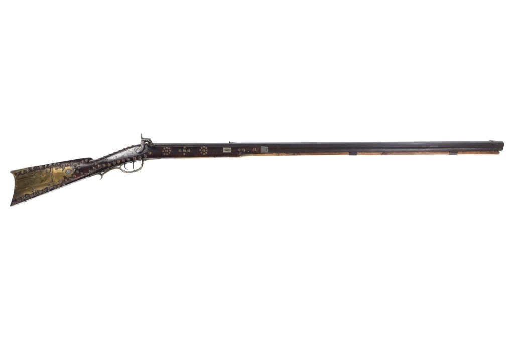 Half-Stock Silver & Tacked Rifle Tecumseh Stamped: The lot features a Pennsylvania / Kentucky Half-Stock muzzleloading flintlock to percussion conversion rifle silver-inlaid, engraved, and brass tacked as well as stamped, ?Tecumseh Rifle Given By