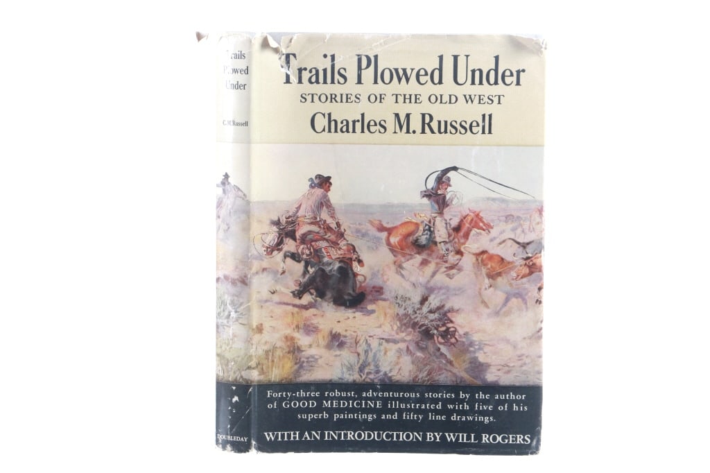 "Trails Plowed Under" Charles Russell 1927 1st Ed.: Featured in this lot is this first edition of, "Trails Plowed Under - Stories of the Old West" by cowboy artist Charles M. Russell, with illustrations in color and line by the author and Introduction