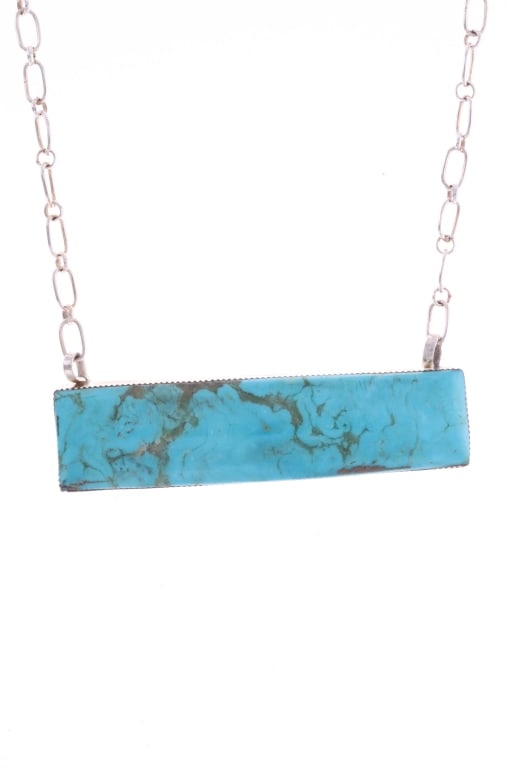 Navajo S. Jack Sterling & Turquoise Necklace: Featured in this lot is this Navajo, Sheena Jack sterling & Cripple Creek turquoise necklace. This necklace features a large and beautiful rectangular cut of Cripple Creek turquoise encased in sterlin