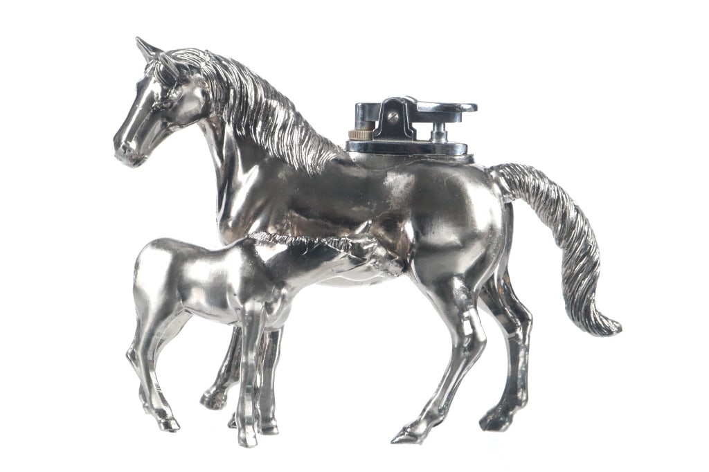 Ca. 1970's Mare & Foal Butane Desk Lighter: Featured in this lot is this mare and foal butane desk lighter circa 1970's. The lighter is wonderfully and professionally crafted construction that shows the likeness of a mare and her foal nursing