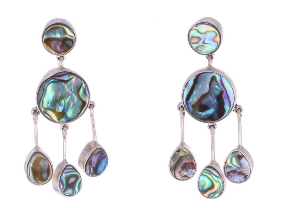 Navajo D&F Sterling & Abalone Dangle Earrings: Featured in this lot is this pair of Navajo sterling & abalone earrings made by Navajo artists Della & Francis James. These earrings feature a dangle design and show set abalone in the center pieces a