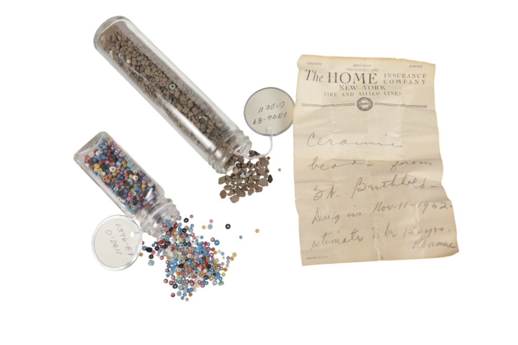 19th C. Fort Berthold Dug Beads ex-C.M. Russell: The lot features two glass bottles full of circa 1800 old glass trade beads dug at Fort Berthold by John Kleinschmidt in November 11, 1952 with accompanying letter from the ex-C.M. Russell Museum