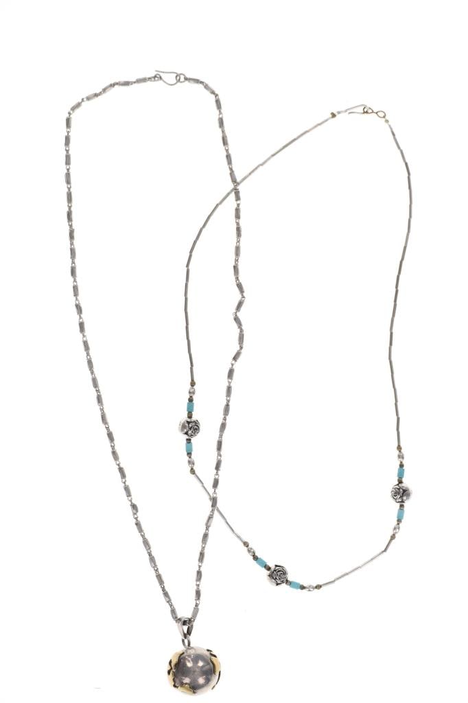 Navajo Sterling Silver Globe Bead Necklace Pair: Featured in this lot is this Navajo sterling silver globe bead necklace pair. There are two necklaces in this collection. The first is a Navajo sterling islver floral globe beaded necklace with