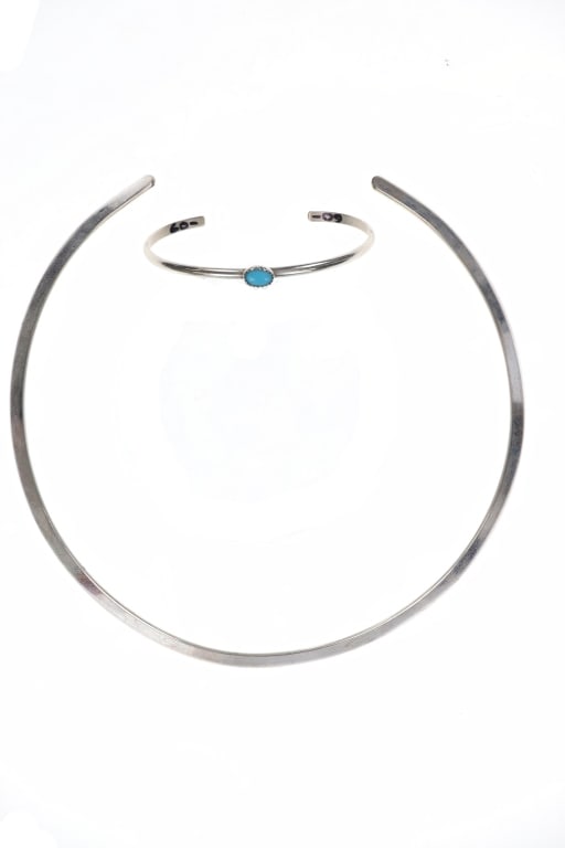Navajo Silver Turquoise Choker & Bracelet c. 1960s: Featured in this lot is this Navajo silver turquoise choker and bracelet circa 1960's. The jewelry features a wonderfully and professionally crafted silver construction. The choker is a single piece f
