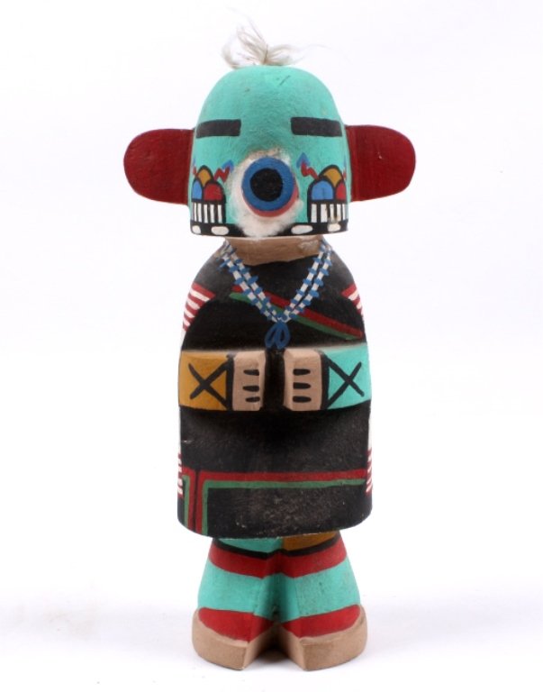 Hopi Kachina: This is hand made by the Hopi Native Americans and features a vibrant color and wonderful designed Kachina doll. This piece is from the 1940-1960's. The piece measures 8.75" tall and 2.75" wide.