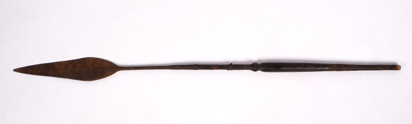 Kuba Kingdom Spear 1800's: This piece is from the 1800's from the Kuba Kingdom in the Congo and is all hand forged iron. This shows a large head, meaning it was most likely from a young warrior. This piece shows a carved wooden