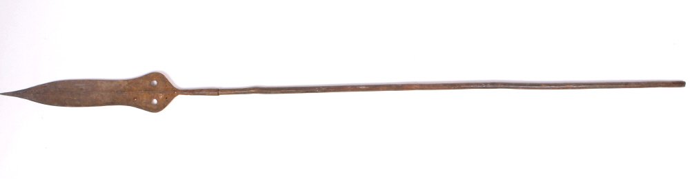 Kuba Kingdom Spear 1800's: This piece is from the 1800's from the Kuba Kingdom in the Congo and is all hand forged iron. This shows a large head, meaning it was most likely from a young warrior. This piece shows a carved wooden
