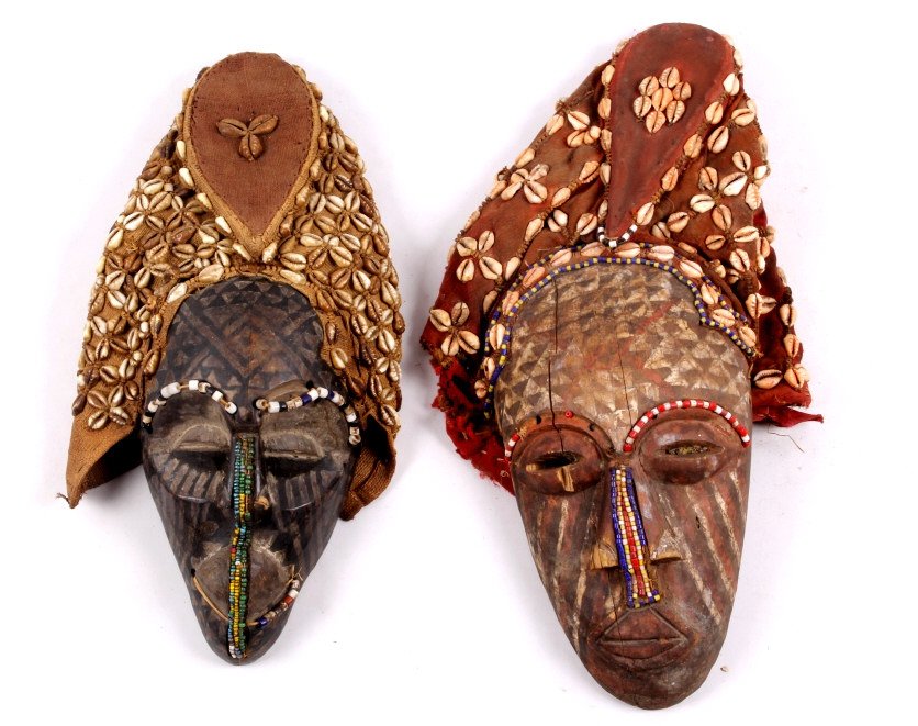 Kongo Kuba Hat Masks: These are hand made by the Tribal people from the Kingdom of Kuba in Africa. These are from the 1800-1900's with hand carved wood, trade beads, old trade clothe, and cowries shells. The mask both are 