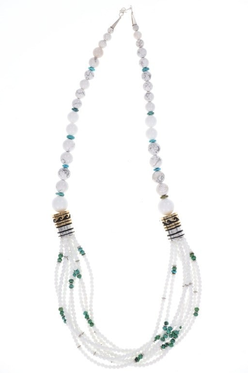 Navajo Singer Sterling 14kGF Turquoise Necklace: Featured in this lot is this sterling silver 14k GF turquoise and Howlite necklace from Navajo artist Tommy and Rose Singer. The necklace features a wonderfully and professionally crafted Howlite, tur