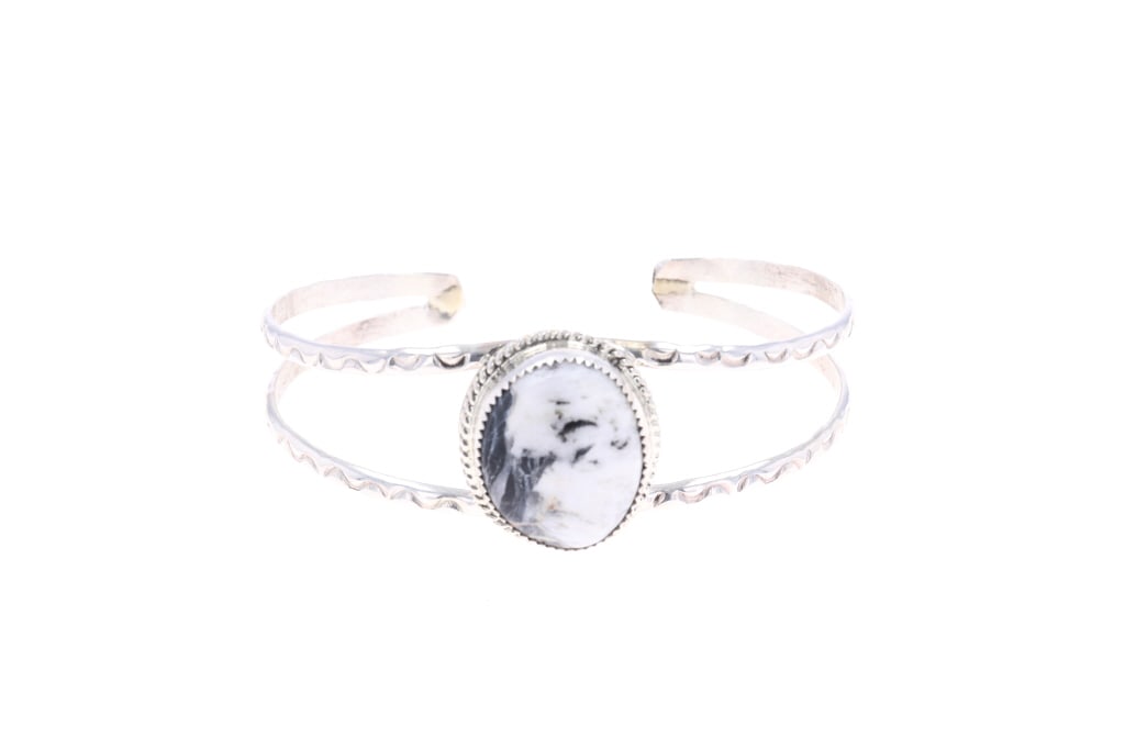 Navajo C. Begay Sterling White Buffalo Bracelet: Featured in this lot is this sterling silver White Buffalo turquoise bracelet from Navajo artist Cynthia Begay. The bracelet features a wonderfully and professionally crafted sterling silver and White