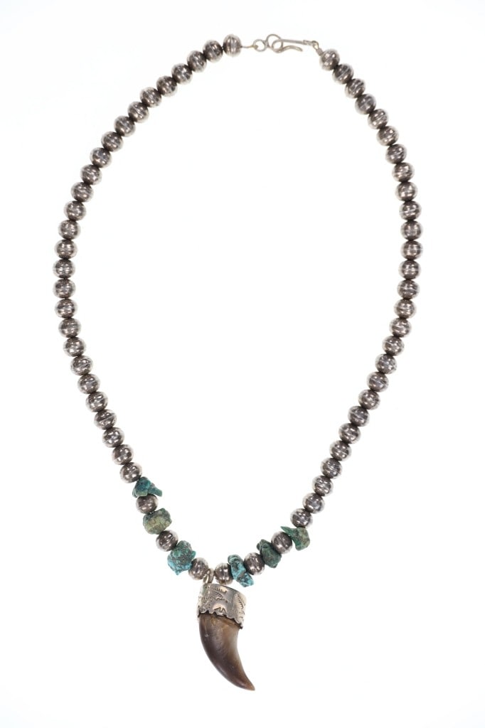 Navajo Sterling Silver Pearl & Bear Claw Necklace: Featured in this lot is this Navajo sterling silver pearl and bear claw necklace circa 1970's. The necklace features a wonderfully and professionally crafted sterling silver and turquoise nugget const