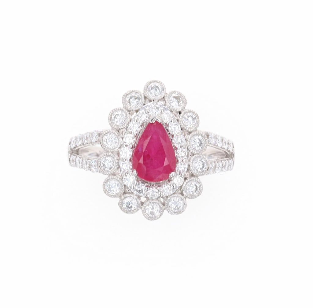 Platinum 1.33ct Ruby and 0.82ct Diamond Ring: The lot features an AIG electronically tested Platinum Ruby and Diamond Ring with a bright polish finish. The featured ruby is set within a diamond floret bezel supported by diamond set split shoulder