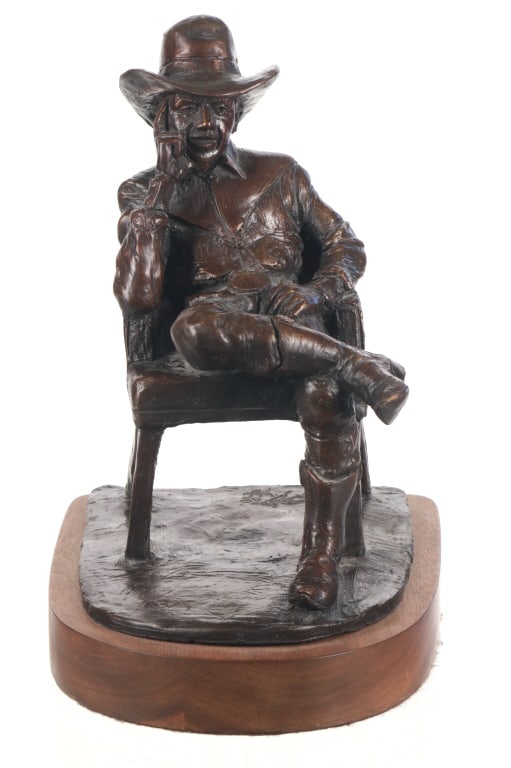 Jim Rennert (B. 1958) Self Portrait Cowboy Attire: Featured in this lot is this self portrait in cowboy attire bronze circa 1995 by American sculptor Jim Rennert born in 1958. The sculpture features a wonderfully and professionally crafted bronze cons