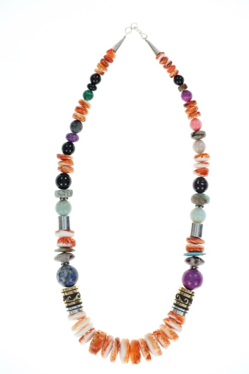 Navajo Singer Sterling Silver Multistone Necklace: Featured in this lot is this Navajo Tommy and Rose Singer sterling silver and multistone necklace. The necklace features a wonderfully and professionally crafted sterling silver and 14k GF barrel bead
