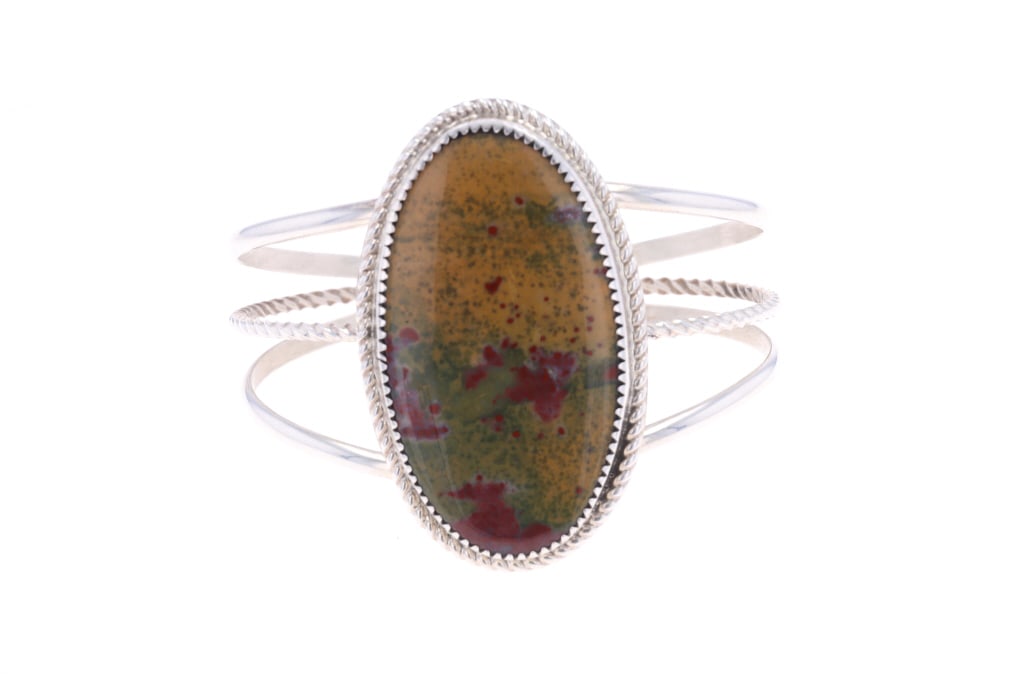 Navajo Herbert Tsosie Sterling Unakite Bracelet: Featured in this lot is this lot is this sterling silver Unakite bracelet from Navajo artist Herbert Tsosie. The bracelet features a wonderfully and professionally crafted sterling silver and Unakite 