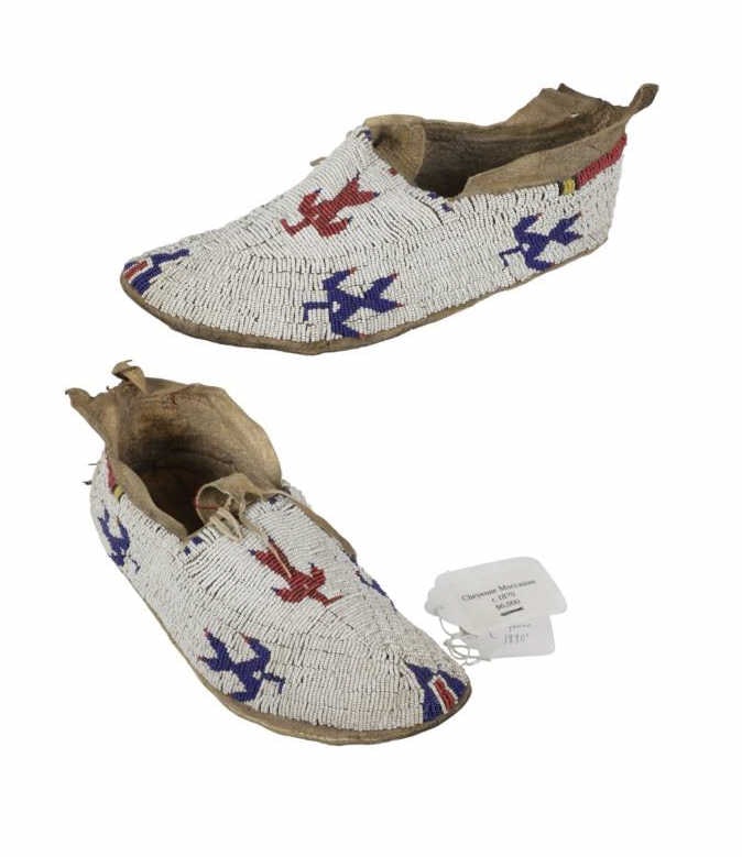 1870 Southern Cheyenne Pictorial Moccasins ex-Fenn: The lot features a truly historic and important set of circa 1870 Southern Cheyenne Pictorial Thunderbird Beaded Buffalo hide and parfleche hard sole moccasins from the ex-collection of Forrest Fenn a