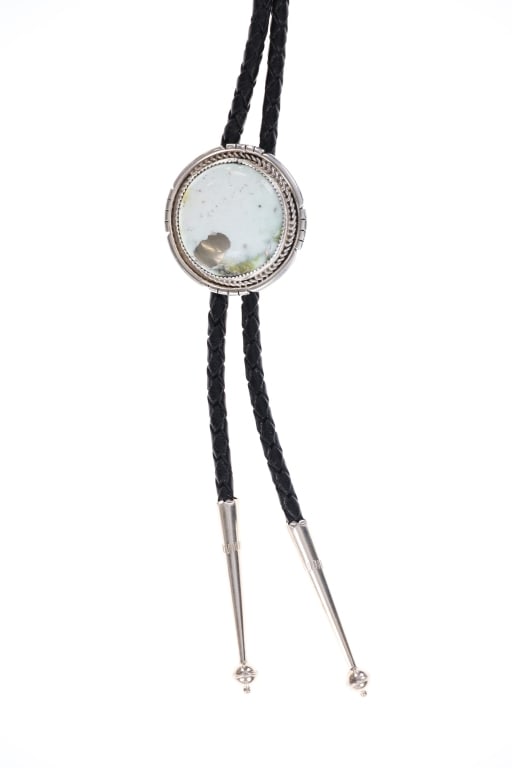 Hopi Virgil Thomas Sterling Silver Turquoise Bolo: Featured in this lot is this sterling silver Dry Creek Turquoise bolo tie from Hopi artist Virgil Thomas. The bolo tie features a wonderfully and professionally crafted sterling silver and Dry Creek T